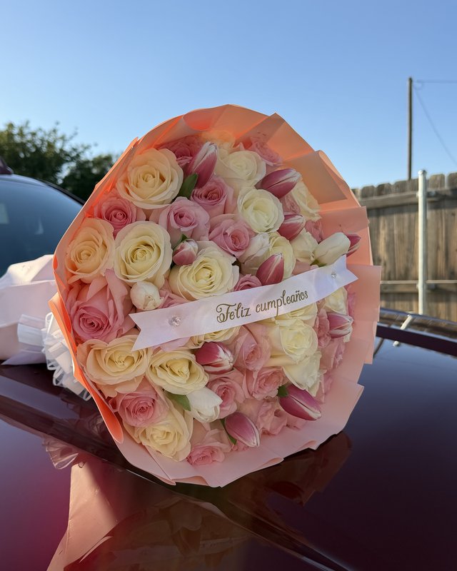 Blush Ramo by Blooms x Mel — Pink, white, and cream roses with tulips tucked throughout in a soft wrap