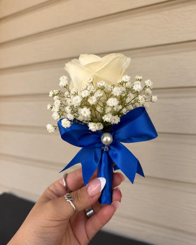 Boutonnière by Blooms x Mel — A fresh rose with baby's breath, ribbon, and pearl pin in your color
