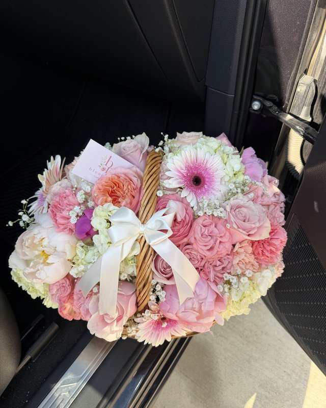 Canasta de Primavera by Blooms x Mel — Peonies, garden roses, and soft pink blooms with hydrangea, gerberas, and baby's breath in a woven basket