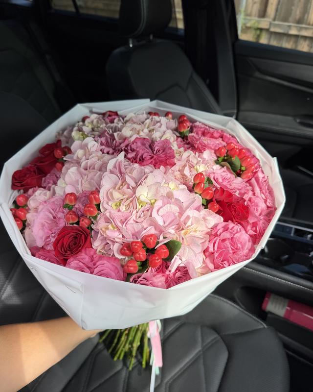 Frambuesa by Blooms x Mel — Pink hydrangeas and garden roses with red roses and hypericum berries in a white wrap