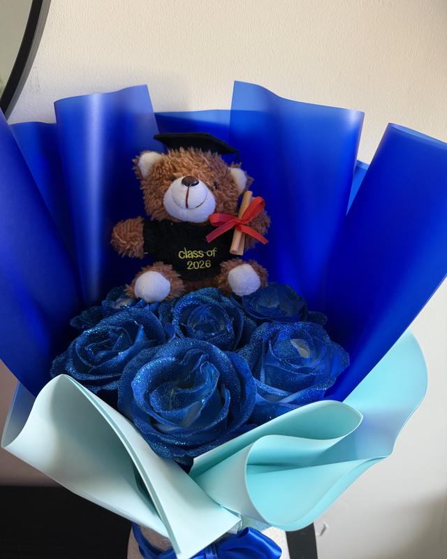 Grad Bear Azul by Blooms x Mel — Blue glitter roses in royal blue wrap with a graduation bear