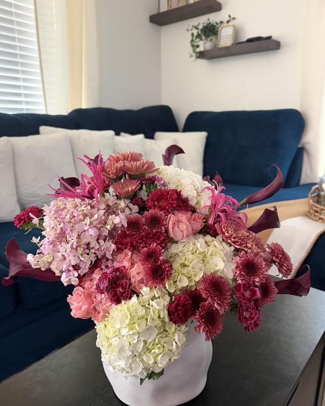 Jardín Rosa by Blooms x Mel — Hydrangeas, garden roses, mums, and burgundy callas in a white ceramic vase