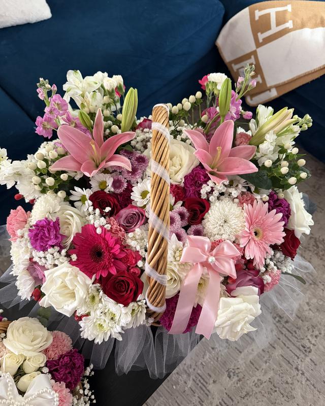 La Canasta Grande by Blooms x Mel — A huge wicker basket overflowing with lilies, roses, gerberas, mums, and more