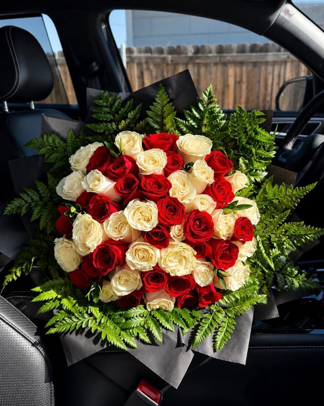 Rojo y Blanco by Blooms x Mel — Red and white roses in a checkered pattern, framed with fresh fern greenery and a black wrap