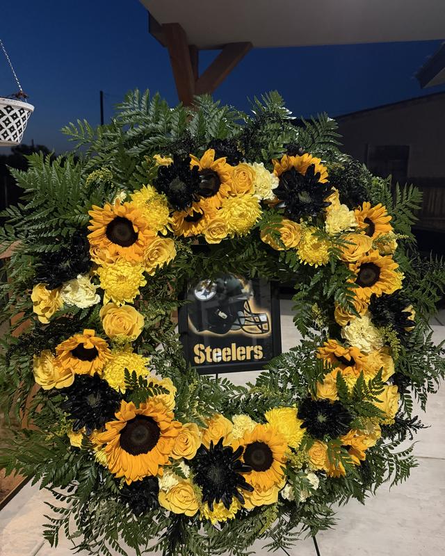 Sunflower Wreath by Blooms x Mel — A full standing wreath of sunflowers, yellow roses, and mums with deep black accents